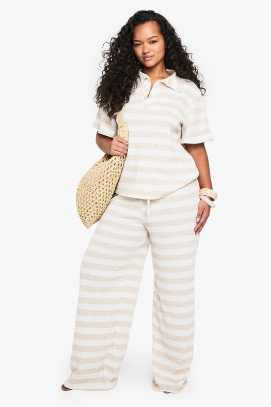 Super oversized fit for ultimate comfort
        Wide leg design for a relaxed silhouette
        Soft jersey fabric for all-day wear
        Striped pattern adds visual interest
        Drawstring waist for adjustable fit
    
    Embrace laid-back chic with these plus-size wide-leg trousers from Boohoo. The super oversized fit and soft jersey fabric offer unparalleled comfort, perfect for those lazy weekends or casual outings. The striped pattern adds a touch of visual intrigue, while the wide-leg design creates a flattering, relaxed silhouette that's on-trend and versatile. Style these trousers with a cropped polo shirt and trainers for a sporty-casual look, or dress them up with a fitted blouse and sandals for a smart-casual ensemble. These trousers are ideal for family gatherings, brunch with friends, or even as stylish lounge wear. The drawstring waist ensures a customisable fit, making these trousers a go-to choice for comfort and style in your everyday wardrobe.
