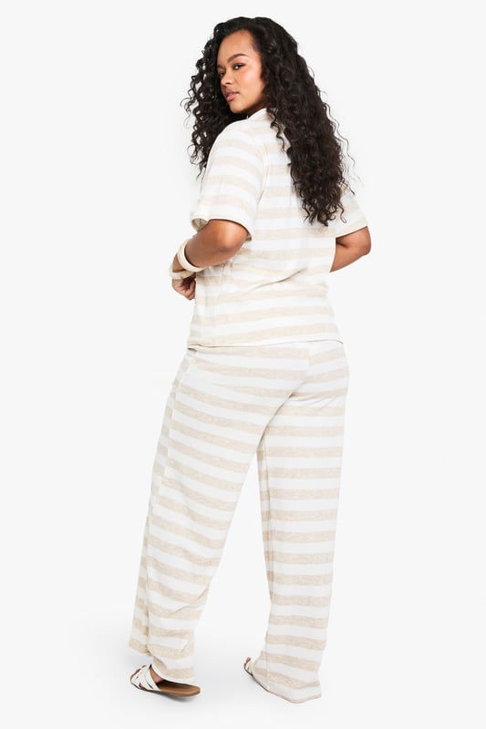 Super oversized fit for ultimate comfort
        Wide leg design for a relaxed silhouette
        Soft jersey fabric for all-day wear
        Striped pattern adds visual interest
        Drawstring waist for adjustable fit
    
    Embrace laid-back chic with these plus-size wide-leg trousers from Boohoo. The super oversized fit and soft jersey fabric offer unparalleled comfort, perfect for those lazy weekends or casual outings. The striped pattern adds a touch of visual intrigue, while the wide-leg design creates a flattering, relaxed silhouette that's on-trend and versatile. Style these trousers with a cropped polo shirt and trainers for a sporty-casual look, or dress them up with a fitted blouse and sandals for a smart-casual ensemble. These trousers are ideal for family gatherings, brunch with friends, or even as stylish lounge wear. The drawstring waist ensures a customisable fit, making these trousers a go-to choice for comfort and style in your everyday wardrobe.