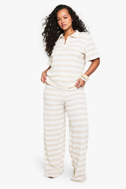Super oversized fit for ultimate comfort
        Wide leg design for a relaxed silhouette
        Soft jersey fabric for all-day wear
        Striped pattern adds visual interest
        Drawstring waist for adjustable fit
    
    Embrace laid-back chic with these plus-size wide-leg trousers from Boohoo. The super oversized fit and soft jersey fabric offer unparalleled comfort, perfect for those lazy weekends or casual outings. The striped pattern adds a touch of visual intrigue, while the wide-leg design creates a flattering, relaxed silhouette that's on-trend and versatile. Style these trousers with a cropped polo shirt and trainers for a sporty-casual look, or dress them up with a fitted blouse and sandals for a smart-casual ensemble. These trousers are ideal for family gatherings, brunch with friends, or even as stylish lounge wear. The drawstring waist ensures a customisable fit, making these trousers a go-to choice for comfort and style in your everyday wardrobe.