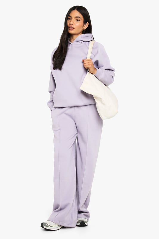 Straight leg joggers featuring distinctive pintuck detailing for a structured silhouette
        Soft fleece-back fabric offers comfort without compromising on style
        High-rise waistband provides a flattering fit and excellent support
        Relaxed straight leg cut allows for effortless movement throughout the day
        Versatile design perfect for creating both casual and athleisure looks
    
    These straight leg pintuck joggers from Boohoo combine comfort with contemporary style for the fashion-forward woman. The structured pintuck detailing adds a refined touch to the classic jogger silhouette, making them suitable for more than just lounging at home. Style them with the matching hoodie as seen on our model for an on-trend coordinated look, or dress them up with a fitted bodysuit and trainers for casual outings. The straight leg cut offers a more polished alternative to traditional tapered joggers, while the soft fleece-back fabric ensures all-day comfort. Perfect for weekend brunches, running errands, or casual meet-ups with friends. Add a tote bag and minimal jewellery to complete the look. These joggers strike the ideal balance between relaxed and put-together, making them an essential addition to your casual wardrobe.