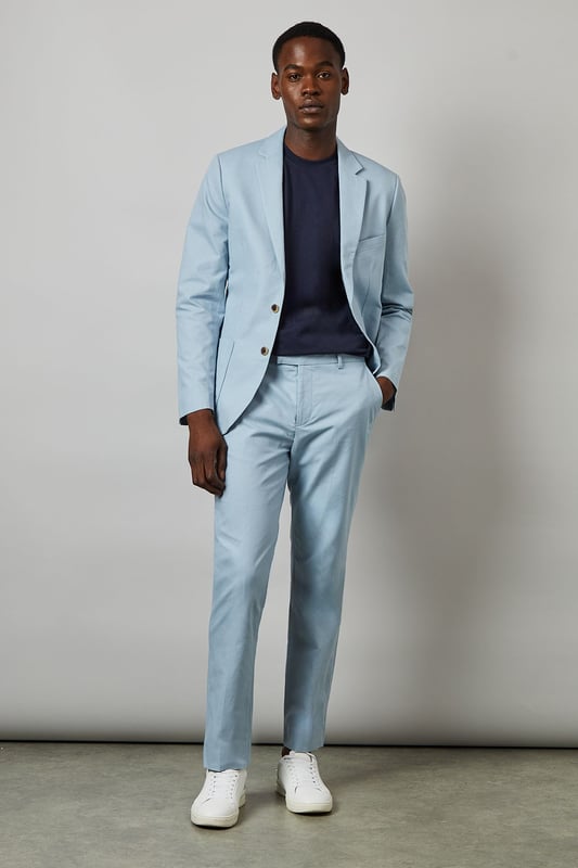 Crafted from a cotton-linen blend fabric for breathable comfort and a natural texture
        Slim fit design offers a modern, tailored silhouette that flatters the leg
        Clean front with side pockets and button-through back pockets for practicality
        Versatile light hue perfect for seasonal dressing throughout spring and summer
        Crisp centre crease adds structure and a refined finishing touch
    
    These Burton slim fit suit trousers combine classic tailoring with contemporary style. The cotton-linen blend fabric delivers a lightweight feel that's ideal for warmer weather whilst maintaining a smart appearance. Style with the matching jacket for formal occasions, or dress down with a navy crew neck and white trainers as shown for smart-casual events. The clean lines and refined cut make these trousers particularly suitable for summer weddings, garden parties, or race days. For the office, pair with a crisp shirt and loafers for a sophisticated look that transitions seamlessly from day to evening. The natural fabric blend allows for comfort during extended wear, making these trousers a practical yet stylish addition to any gentleman's wardrobe - perfect for the man who appreciates timeless style with modern sensibility.