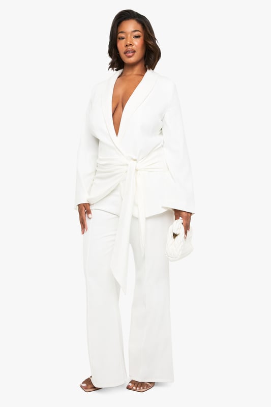 Flattering slim-fit design with dramatic flared hem for a striking silhouette
        High-waisted cut to enhance and define your natural curves
        Smooth, flowing fabric that moves beautifully with every step
        Versatile trousers that transition effortlessly from day to evening
        Plus-size design crafted specifically to celebrate fuller figures
    
    Make a bold statement in these eye-catching flared trousers from Boohoo's latest collection. The slim-fit design hugs your curves in all the right places before dramatically flaring out at the hem, creating a stunning retro-inspired silhouette that commands attention. Perfect for formal occasions, these trousers can be styled with the matching wrap top as shown for a coordinated ensemble that exudes confidence. Pair with strappy heels and statement jewellery for weddings or graduations, or dress down with a fitted blouse and block heels for dinner dates. The high waist provides excellent support and structure, whilst the flared leg elongates your silhouette beautifully. These trousers offer the perfect balance of comfort and sophistication, ensuring you'll stand out for all the right reasons at your next special event.