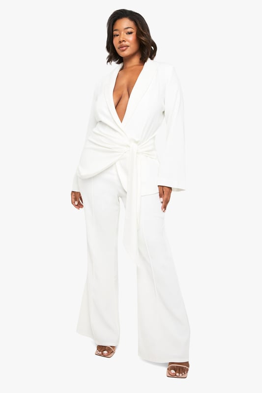 Flattering slim-fit design with dramatic flared hem for a striking silhouette
        High-waisted cut to enhance and define your natural curves
        Smooth, flowing fabric that moves beautifully with every step
        Versatile trousers that transition effortlessly from day to evening
        Plus-size design crafted specifically to celebrate fuller figures
    
    Make a bold statement in these eye-catching flared trousers from Boohoo's latest collection. The slim-fit design hugs your curves in all the right places before dramatically flaring out at the hem, creating a stunning retro-inspired silhouette that commands attention. Perfect for formal occasions, these trousers can be styled with the matching wrap top as shown for a coordinated ensemble that exudes confidence. Pair with strappy heels and statement jewellery for weddings or graduations, or dress down with a fitted blouse and block heels for dinner dates. The high waist provides excellent support and structure, whilst the flared leg elongates your silhouette beautifully. These trousers offer the perfect balance of comfort and sophistication, ensuring you'll stand out for all the right reasons at your next special event.