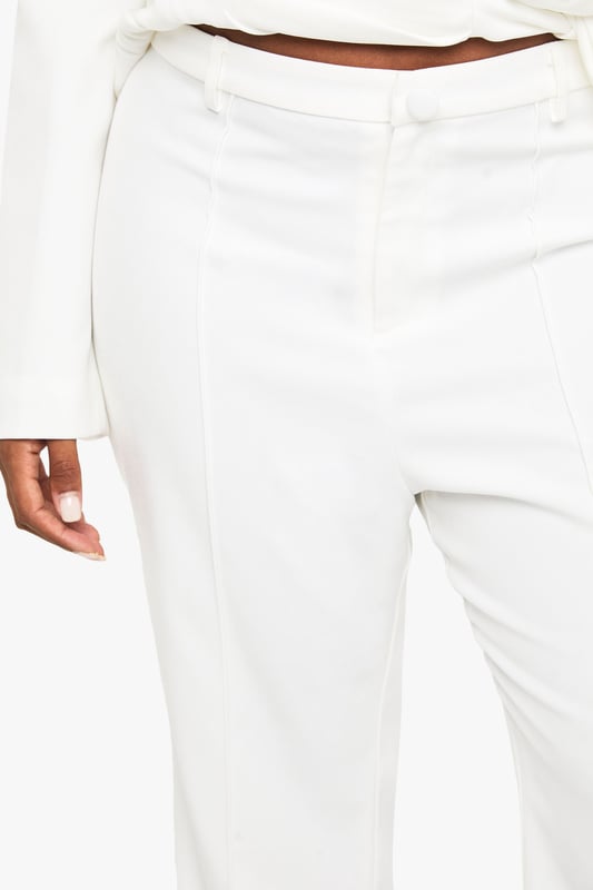 Flattering slim-fit design with dramatic flared hem for a striking silhouette
        High-waisted cut to enhance and define your natural curves
        Smooth, flowing fabric that moves beautifully with every step
        Versatile trousers that transition effortlessly from day to evening
        Plus-size design crafted specifically to celebrate fuller figures
    
    Make a bold statement in these eye-catching flared trousers from Boohoo's latest collection. The slim-fit design hugs your curves in all the right places before dramatically flaring out at the hem, creating a stunning retro-inspired silhouette that commands attention. Perfect for formal occasions, these trousers can be styled with the matching wrap top as shown for a coordinated ensemble that exudes confidence. Pair with strappy heels and statement jewellery for weddings or graduations, or dress down with a fitted blouse and block heels for dinner dates. The high waist provides excellent support and structure, whilst the flared leg elongates your silhouette beautifully. These trousers offer the perfect balance of comfort and sophistication, ensuring you'll stand out for all the right reasons at your next special event.