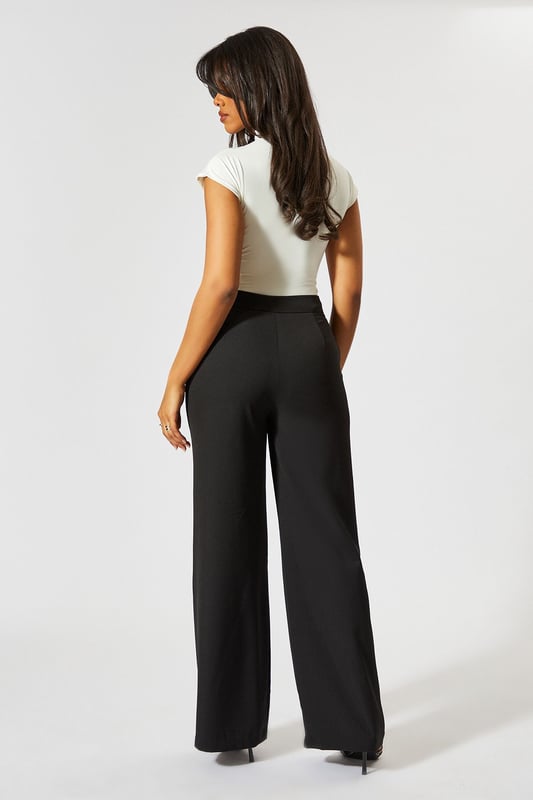 Wide leg silhouette for a relaxed, on-trend look
        Tie-side detail adds a unique, customisable touch
        High-waisted design for a flattering fit
        Tailored construction offers a polished appearance
        Side pockets for practicality and style
    
    Make a statement with these wide leg tie side tailored trousers from MissPap. Perfect for the fashion-forward woman who loves to stand out, these trousers blend comfort with chic style. The high-waisted design elongates your silhouette, while the wide leg cut creates a dramatic, flowing effect as you move. Dress them up for a night out with a crop top and strappy heels, or keep it casual for daytime events with a fitted tee and trainers. The tie-side detail allows you to adjust the fit to your liking, adding a personalised touch to your look. Whether you're heading to a family gathering or meeting friends for brunch, these versatile trousers will ensure you're always dressed to impress. Pair with a sleek blazer for a more formal occasion, or throw on an oversized jumper for a cosy yet stylish ensemble.