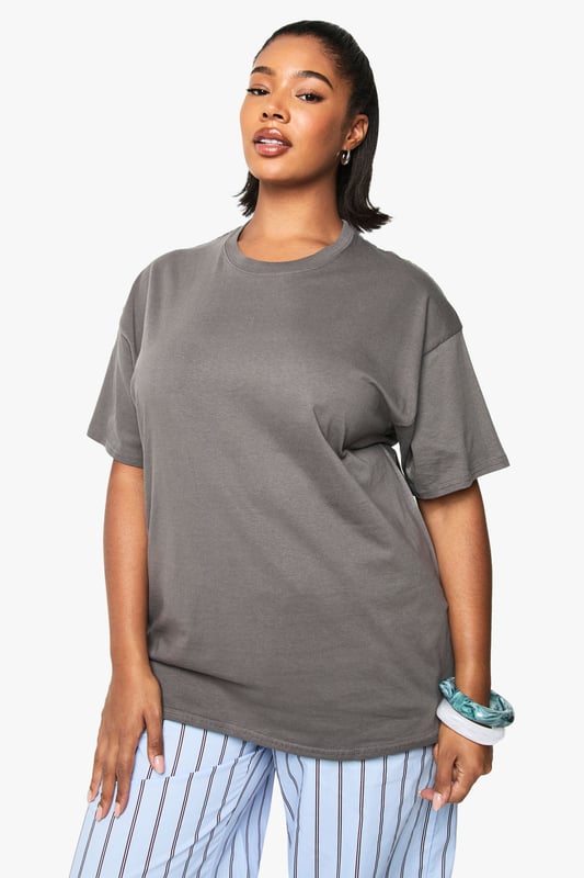 Oversized cotton t-shirt featuring a vibrant cherry graphic with 'Sweet' text print
        Relaxed crew neckline for everyday comfort
        Dropped shoulders and roomy sleeves for the perfect slouchy silhouette
        Generous length providing extra coverage and styling versatility
        Soft cotton fabric offering breathable comfort for all-day wear
    
    Make a statement with this eye-catching oversized t-shirt from boohoo's latest collection. The playful cherry graphic adds a fun, youthful touch to this casual essential. Style it as seen with striped trousers for a contemporary clash of patterns that works brilliantly for daytime outings. For a more relaxed approach, pair with denim shorts and trainers during warmer months, or layer under a denim jacket when the temperature drops. This versatile piece transitions effortlessly from casual coffee dates to weekend shopping trips. The generous fit makes it perfect for tucking into high-waisted bottoms or wearing loose for a more laid-back feel. Accessorise with chunky jewellery and a crossbody bag, as shown, to complete your look with personality and flair.
