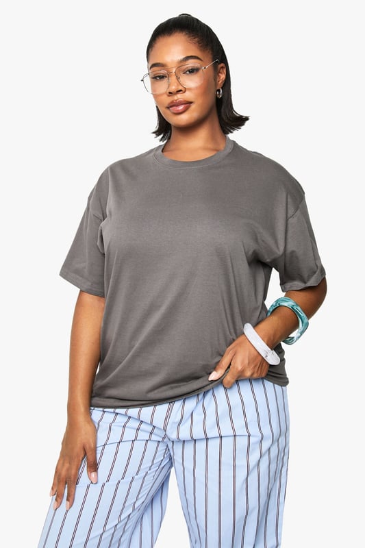 Oversized cotton t-shirt featuring a vibrant cherry graphic with 'Sweet' text print
        Relaxed crew neckline for everyday comfort
        Dropped shoulders and roomy sleeves for the perfect slouchy silhouette
        Generous length providing extra coverage and styling versatility
        Soft cotton fabric offering breathable comfort for all-day wear
    
    Make a statement with this eye-catching oversized t-shirt from boohoo's latest collection. The playful cherry graphic adds a fun, youthful touch to this casual essential. Style it as seen with striped trousers for a contemporary clash of patterns that works brilliantly for daytime outings. For a more relaxed approach, pair with denim shorts and trainers during warmer months, or layer under a denim jacket when the temperature drops. This versatile piece transitions effortlessly from casual coffee dates to weekend shopping trips. The generous fit makes it perfect for tucking into high-waisted bottoms or wearing loose for a more laid-back feel. Accessorise with chunky jewellery and a crossbody bag, as shown, to complete your look with personality and flair.