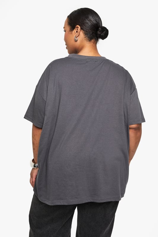 Versatile 2-pack of oversize T-shirts
        Relaxed fit for ultimate comfort
        Soft jersey fabric for all-day wear
        Crew neckline for a classic look
        Short sleeves with dropped shoulders
    
    Embrace laid-back chic with this duo of oversize T-shirts from Boohoo's plus-size collection. Perfect for the fashion-forward woman who values both style and comfort, these versatile pieces are ideal for creating effortless everyday looks. The relaxed silhouette allows for easy layering, making them suitable for various casual occasions. Style them with your favourite denim for a classic ensemble, or pair with wide-leg trousers and trainers for a trendy street-style vibe. These T-shirts are your go-to for family gatherings, weekend brunches, or casual outings with friends. The soft jersey fabric ensures all-day comfort, whether you're running errands or lounging at home. With their timeless design and generous fit, these T-shirts are set to become staples in your wardrobe, offering endless styling possibilities for the modern, confident woman.