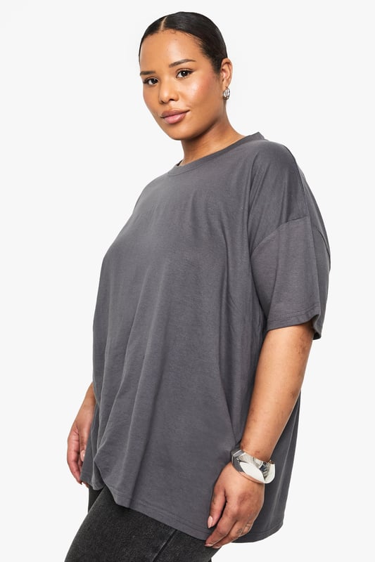 Versatile 2-pack of oversize T-shirts
        Relaxed fit for ultimate comfort
        Soft jersey fabric for all-day wear
        Crew neckline for a classic look
        Short sleeves with dropped shoulders
    
    Embrace laid-back chic with this duo of oversize T-shirts from Boohoo's plus-size collection. Perfect for the fashion-forward woman who values both style and comfort, these versatile pieces are ideal for creating effortless everyday looks. The relaxed silhouette allows for easy layering, making them suitable for various casual occasions. Style them with your favourite denim for a classic ensemble, or pair with wide-leg trousers and trainers for a trendy street-style vibe. These T-shirts are your go-to for family gatherings, weekend brunches, or casual outings with friends. The soft jersey fabric ensures all-day comfort, whether you're running errands or lounging at home. With their timeless design and generous fit, these T-shirts are set to become staples in your wardrobe, offering endless styling possibilities for the modern, confident woman.