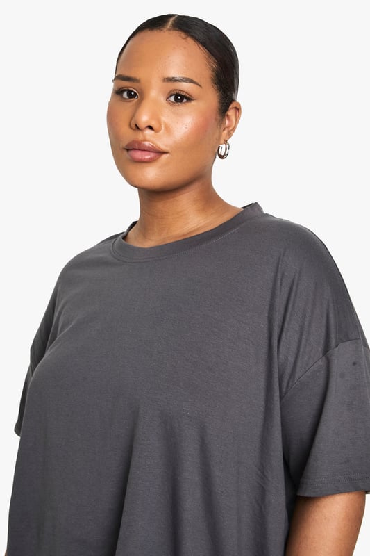Versatile 2-pack of oversize T-shirts
        Relaxed fit for ultimate comfort
        Soft jersey fabric for all-day wear
        Crew neckline for a classic look
        Short sleeves with dropped shoulders
    
    Embrace laid-back chic with this duo of oversize T-shirts from Boohoo's plus-size collection. Perfect for the fashion-forward woman who values both style and comfort, these versatile pieces are ideal for creating effortless everyday looks. The relaxed silhouette allows for easy layering, making them suitable for various casual occasions. Style them with your favourite denim for a classic ensemble, or pair with wide-leg trousers and trainers for a trendy street-style vibe. These T-shirts are your go-to for family gatherings, weekend brunches, or casual outings with friends. The soft jersey fabric ensures all-day comfort, whether you're running errands or lounging at home. With their timeless design and generous fit, these T-shirts are set to become staples in your wardrobe, offering endless styling possibilities for the modern, confident woman.
