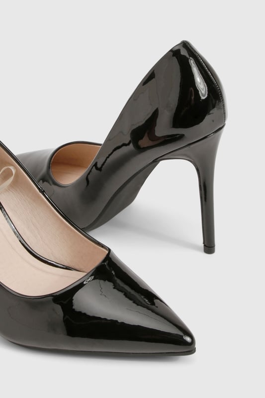 Sleek stiletto heels measuring between 7-9cm for a striking silhouette
        Pointed toe design creates a flattering, leg-lengthening effect
        Glossy PU finish offers a sophisticated, high-shine appearance
        Classic slip-on style for effortless wear and versatility
        Cushioned footbed provides comfort throughout your night out
    
    These timeless stiletto heels from Boohoo are the ultimate going-out essential for the fashion-forward woman. The sharp pointed toe and sleek silhouette create a refined look that pairs brilliantly with everything from tailored trousers to mini dresses. Style them with a figure-hugging midi dress and statement clutch for cocktails with the girls, or team with straight-leg jeans and an oversized blazer for a chic contrast of casual and formal. The versatile design makes these heels perfect for transitioning from office to evening drinks without missing a beat. Their classic shape ensures they'll remain a wardrobe staple season after season, while the high-shine finish adds a touch of glamour to any ensemble. These stilettos are designed to command attention whilst maintaining that essential balance of sophistication and contemporary style.