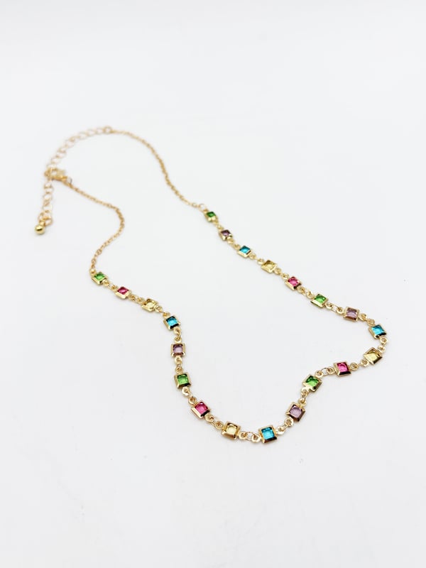 A stunning statement piece featuring interlinked square-shaped crystals in a dazzling array of colors. Perfect for adding a pop of brightness to any outfit, this necklace combines elegance with a bold, modern aesthetic.
Colour: Gold/ Multi
Zinc alloy
Stone: Crystal
Length 38cm + 8cm
SKU:JE404101