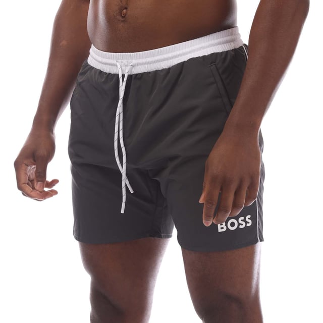 Mens Hugo Starfish Swim Shorts in charcoal.- Elasticated drawstring waist.- Side pockets.- Back pocket.- Boss branding on the leg.- Mesh polyester lining enhances breathability and comfort for a seamless swimming experience.- 100% Polyester (Recycled).- Ref: 50515191011