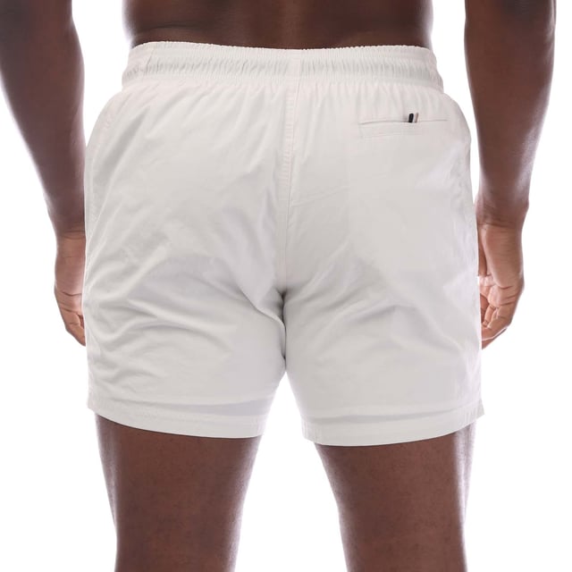 Mens Hugo Boss Octopus Swim Shorts in white.- Elasticated drawstring waistband with aglet tips.- Hand pockets.- Back pocket.- Inner mesh brief lining.- Vertical logo in contrast.- Quick-drying fabric with full lining.- 100% Polyester (Recycled).- Ref: 50515296100