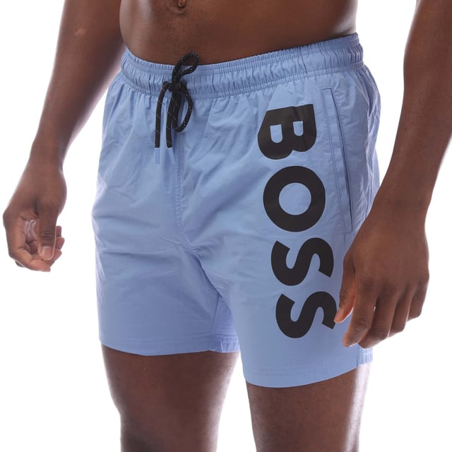 Mens Hugo Boss Octopus Swim Shorts in blue.- Elasticated drawstring waist.- Side pockets.- Back pockets.- Vertical logo in contrast.- Full lining.- 100% Polyamide (Recycled).- Ref: 50515296430