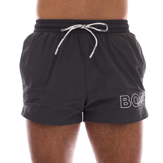 Mens Hugo Boss Mooneye Swim Shorts in charcoal.- Elastic waistband.- Side pockets.- Short length.- Plastic-tipped drawcords with further branding complete this pair.- Printed with a large BOSS logo.- 100% Polyamide.- Ref: 50469280011