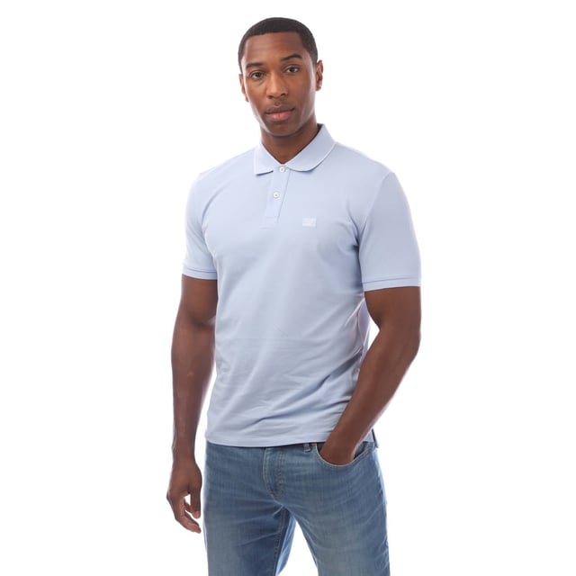 Mens C.P. Company Stretch Piquet Logo Polo Shirt in blue.- Ribbed polo collar.- Short sleeves with ribbed cuffs.- Two button fastened placket.- Logo patch at the chest.- Split hem to the sides.- Straight hem.- 95% Cotton  5% Elastane.- Ref: 18CMPL097A814