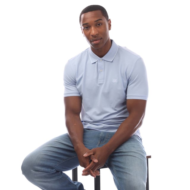 Mens C.P. Company Stretch Piquet Logo Polo Shirt in blue.- Ribbed polo collar.- Short sleeves with ribbed cuffs.- Two button fastened placket.- Logo patch at the chest.- Split hem to the sides.- Straight hem.- 95% Cotton  5% Elastane.- Ref: 18CMPL097A814
