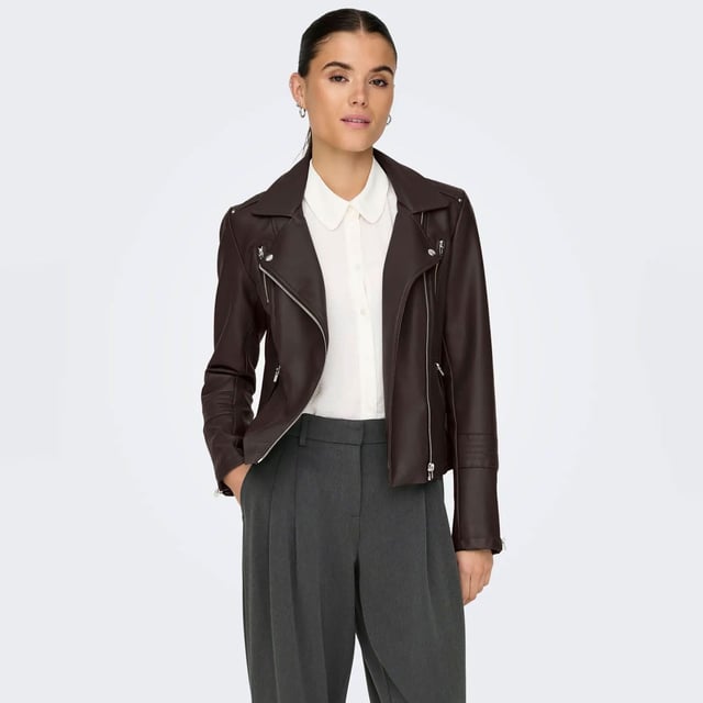 Womens Only Gemma Faux Leather Biker Jacket in chocolate torte- Classic collar with notch lapel.- Asymmetric zip fastening.- Snap fastening at lapels.- Stitch detail at shoulders and sleeves.- Zipped cuffs.- Zipped front pockets.- Mock zipped chest pockets.- Fully lined. - Measurement from shoulder to hem: 20in approximately. - Shell: 75% Viscose  25% Polyester.  Coating: Polyurethane.  Lining: 100% Polyester. Machine washable. - Ref: 15153079Measurements are intended for guidance only.