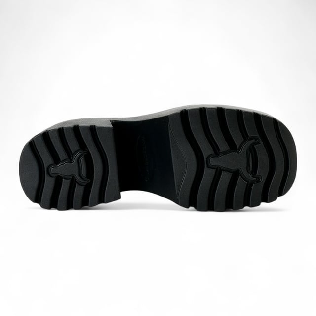 Step into bold style with the Windsor Smith Lessons platform shoes — a modern twist on the classic Mary-Jane. Crafted with a smooth black leather upper, these chunky platforms feature twin adjustable straps with silver hardware, eyelet detailing, and Windsor Smith’s signature bull symbol on the side. Designed for statement-makers, they boast a cleated, lightweight PU sole, a towering 9 cm heel, and a 4.6 cm platform for comfort and impact. With a rounded toe and edgy detailing, they're perfect for elevating any outfit.

Upper: Premium Leather
Lining: Non-Leather
Sole: Lightweight PU
Closure: Twin adjustable straps with silver eyelets
Toe: Rounded
Platform Height: 4.6 cm
Heel Height: 9 cm
Details: Cleated sole, silver hardware, bull logo
