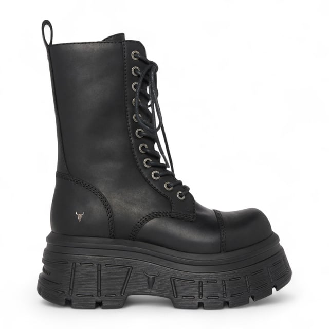 Make a fearless statement with the Windsor Smith Screaming platform boots - where combat style meets elevated edge. Crafted from cow waxy leather, these 11-eyelet lace-up boots feature a chunky cleated platform wedge sole, reinforced toe cap, and heavy cable stitch detail. The inside zip allows for easy slip-on access, while the leather pull tab and embossed bull logo at the back add signature Windsor Smith touches. Designed for attitude and comfort, they stand tall with a 7.5 cm heel and 5.6 cm platform.
Upper: Cow Waxy Leather
Lining: Non-Leather
Sole: Lightweight PU (cleated wedge)
Closure: Lace-up with inside zip
Toe: Round with toe cap
Platform Height: 5.6 cm
Heel Height: 7.5 cm
Design: Chunky combat boot with heavy stitch detail
Branding: Embossed bull logo at back