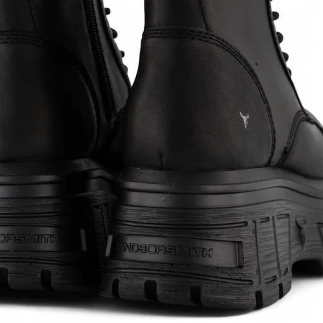Make a fearless statement with the Windsor Smith Screaming platform boots - where combat style meets elevated edge. Crafted from cow waxy leather, these 11-eyelet lace-up boots feature a chunky cleated platform wedge sole, reinforced toe cap, and heavy cable stitch detail. The inside zip allows for easy slip-on access, while the leather pull tab and embossed bull logo at the back add signature Windsor Smith touches. Designed for attitude and comfort, they stand tall with a 7.5 cm heel and 5.6 cm platform.
Upper: Cow Waxy Leather
Lining: Non-Leather
Sole: Lightweight PU (cleated wedge)
Closure: Lace-up with inside zip
Toe: Round with toe cap
Platform Height: 5.6 cm
Heel Height: 7.5 cm
Design: Chunky combat boot with heavy stitch detail
Branding: Embossed bull logo at back