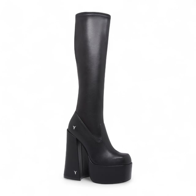 Own the spotlight in the Windsor Smith Survival black stretch platform boots. These striking knee-high sock boots feature a sleek, non-leather upper that hugs the leg for a bold, sculpted silhouette. Set on towering 15.2 cm chunky block heels with a 5.7 cm platform, they offer dramatic height without compromising stability. Complete with Windsor Smith's iconic bullhead logo on the heel and sole, these boots are designed to turn heads and elevate your wardrobe.

Upper: Black Stretch (Non-Leather)
Lining: Non-Leather
Sole: Non-Leather
Style: Knee-high sock boots
Heel Height: 15.2 cm
Platform Height: 5.7 cm
Design: Chunky platform block heel