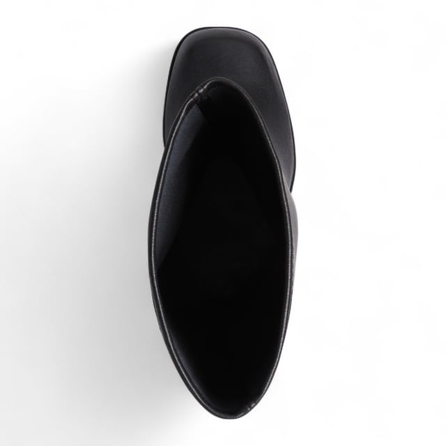 Own the spotlight in the Windsor Smith Survival black stretch platform boots. These striking knee-high sock boots feature a sleek, non-leather upper that hugs the leg for a bold, sculpted silhouette. Set on towering 15.2 cm chunky block heels with a 5.7 cm platform, they offer dramatic height without compromising stability. Complete with Windsor Smith's iconic bullhead logo on the heel and sole, these boots are designed to turn heads and elevate your wardrobe.

Upper: Black Stretch (Non-Leather)
Lining: Non-Leather
Sole: Non-Leather
Style: Knee-high sock boots
Heel Height: 15.2 cm
Platform Height: 5.7 cm
Design: Chunky platform block heel