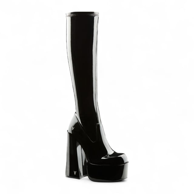 Own the spotlight in the Windsor Smith Saucy black stretch platform boots. These striking knee-high sock boots feature a sleek, non-leather upper that hugs the leg for a bold, sculpted silhouette. Set on towering 15.2 cm chunky block heels with a 5.7 cm platform, they offer dramatic height without compromising stability. Complete with Windsor Smith's iconic bullhead logo on the heel and sole, these boots are designed to turn heads and elevate your wardrobe.

Upper: Black Stretch (Non-Leather)
Lining: Non-Leather
Sole: Non-Leather
Style: Knee-high sock boots
Heel Height: 15.2 cm
Platform Height: 5.7 cm
Design: Chunky platform block heel