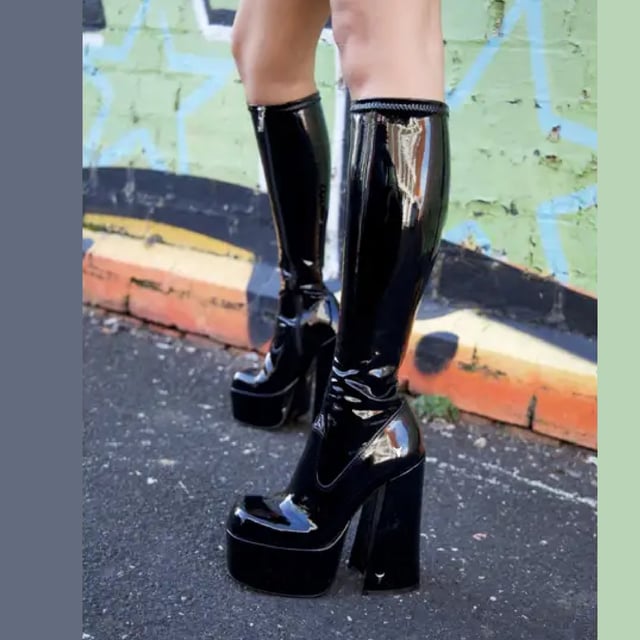 Own the spotlight in the Windsor Smith Saucy black stretch platform boots. These striking knee-high sock boots feature a sleek, non-leather upper that hugs the leg for a bold, sculpted silhouette. Set on towering 15.2 cm chunky block heels with a 5.7 cm platform, they offer dramatic height without compromising stability. Complete with Windsor Smith's iconic bullhead logo on the heel and sole, these boots are designed to turn heads and elevate your wardrobe.

Upper: Black Stretch (Non-Leather)
Lining: Non-Leather
Sole: Non-Leather
Style: Knee-high sock boots
Heel Height: 15.2 cm
Platform Height: 5.7 cm
Design: Chunky platform block heel