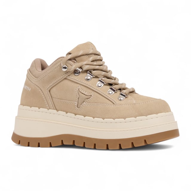 Meet the Windsor Smith Ultimatum - Women’s platform sneakers redefined with a rugged twist. Crafted with a soft sand suede upper and contrast stitching, these chunky sneakers feature a two-tone TPR platform sole that combines street style with hiking influence. Metal hook-and-eye details and bull-logo silver D-rings elevate the design, while the twin-colored laces, padded tongue, and collar offer added comfort. With a 63 mm heel and a 46 mm forepart platform, these cross-hiker sneakers deliver elevated style without compromising stability.

Upper: Sand Suede
Lining: Sports Fabric
Sole: Two-tone Chunky TPR
Closure: Twin-colored lace with metal hook & eye + D-rings
Heel Height: 63 mm
Platform Forepart Height: 46 mm
Design: Cross between hiker boot and sneaker
Details: Padded tongue and collar, contrast stitching, molded footbed