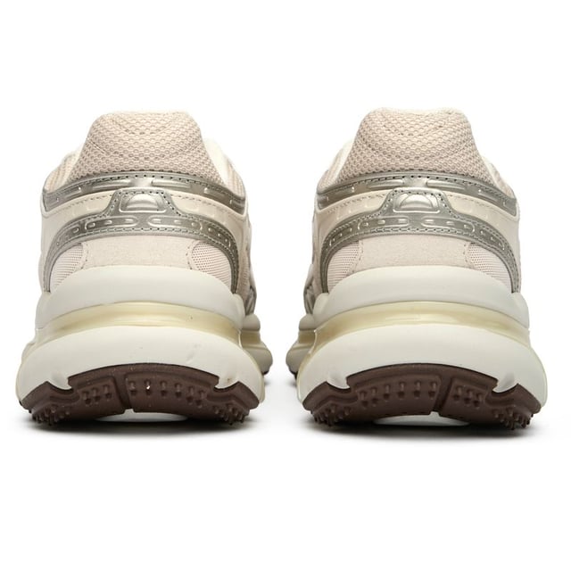 The Lacoste L003 2k42 in natural offers women a sophisticated take on running-inspired footwear. These sleek trainers combine style with practical comfort, featuring an Ortholite footbed and cushioning foam insoles that cradle your feet all day. The synthetic upper maintains its pristine appearance while the durable rubber sole provides reliable traction. With an EVA midsole for lightweight support and a reinforced heel for stability, these Lacoste trainers deliver the perfect balance of athletic functionality and casual elegance.