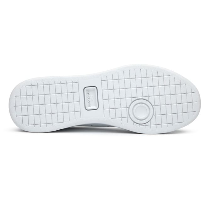 The Lacoste Carnaby Set brings classic court style to your casual collection. These elegant white leather trainers showcase subtle metallic accents that catch the light as you move. With Lacoste's signature branding tastefully placed on the tongue, heel, and quarter, these shoes offer understated luxury. The sturdy rubber cup sole provides reliable traction and durability for everyday wear. Perfect for pairing with anything from tailored trousers to summer dresses.