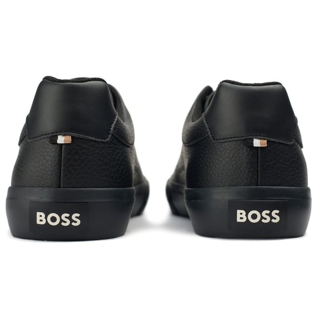 Show up in sleek style and comfort with the BOSS Aiden trainers. These black casual court shoes boast a high-quality leather-look upper, ensuring both durability and a luxe appearance. Underfoot, the robust rubber sole promises superb traction, ideal for urban adventures. The iconic BOSS branding adds a refined touch and designer recognition. Elevate your everyday ensemble with the sophistication of BOSS!