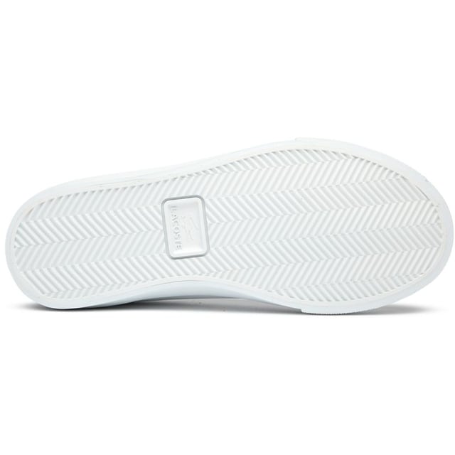 Introducing the Lacoste Lerond Set, classic women's court trainers with a timeless white leather finish. These stylish shoes feature subtle metallic accents that give them a modern edge, while the durable rubber cup sole provides solid support and traction. Iconic Lacoste branding adorns the tongue, heel, and quarter, making these trainers unmistakably premium. Perfect for casual outings or smart-casual occasions, they offer both comfort and sophisticated French styling in one elegant package.