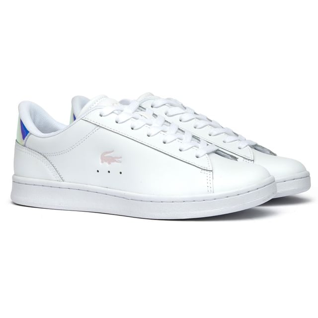 Lacoste Carnaby Set Trainers The Lacoste Carnaby Set offers timeless court-inspired elegance with a modern twist. These white leather trainers blend sophisticated style with practicality, supported by a durable rubber sole for all-day comfort. Subtle metallic accents elevate the classic design, while signature Lacoste branding on the tongue, heel, and quarter adds authentic heritage appeal. Perfect for casual outings or smart-casual occasions, these versatile women's trainers deliver the quality craftsmanship Lacoste is renowned for.