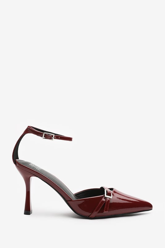 Wheres That From Womens 'Katherine' Strappy Pointed Toe High Heels Make a bold entrance with these Katherine Strappy Pointed Toe High Heels, crafted for standout sophistication. Featuring a pointed toe, slim stiletto heel, and delicate buckle straps, they bring timeless elegance with a modern twist. The glossy finish adds a luxurious edge, perfect for evening events, date nights, or dressing up denim. Key Features: • Material: High-shine patent faux leather upper • Design: Pointed toe with dual buckle strap and stiletto heel • Closure: Adjustable ankle and front buckle straps