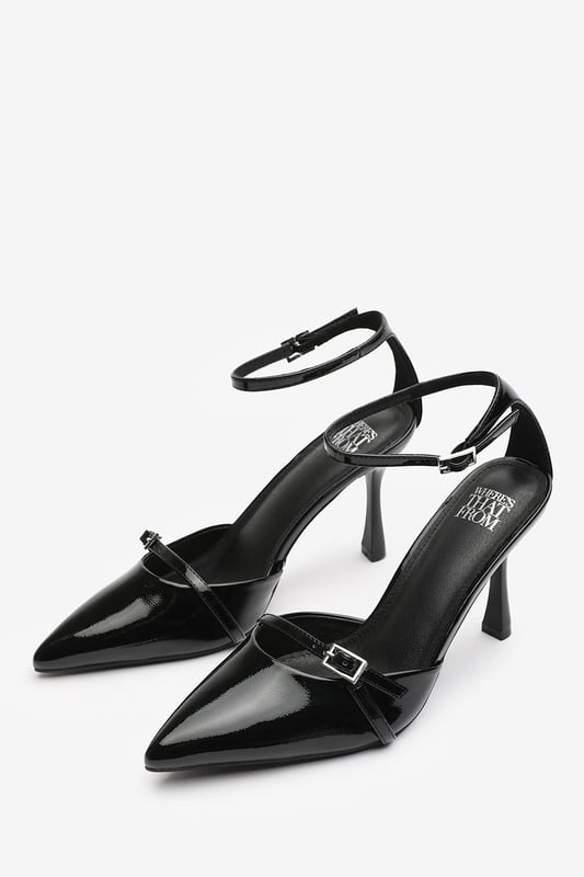 Wheres That From Womens 'Katherine' Strappy Pointed Toe High Heels Make a bold entrance with these Katherine Strappy Pointed Toe High Heels, crafted for standout sophistication. Featuring a pointed toe, slim stiletto heel, and delicate buckle straps, they bring timeless elegance with a modern twist. The glossy finish adds a luxurious edge, perfect for evening events, date nights, or dressing up denim. Key Features: • Material: High-shine patent faux leather upper • Design: Pointed toe with dual buckle strap and stiletto heel • Closure: Adjustable ankle and front buckle straps