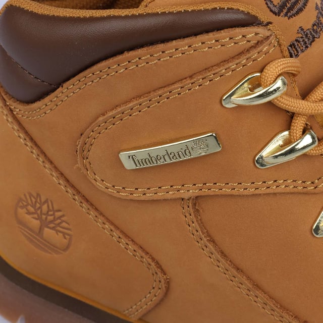Boys Timberland Euro Rock Lace Up Boot in wheat.- Nubuck Leather upper.- Lace up fastening.- Padded collar.- Contrast collar and sole stripe.- Branding to heel side and tongue.- Anti-fatigue removable footbed.- ReBOTL fabric lining containing at least 50% recycled plastic.- Gripstick rubber.- Ref: A43PR2311