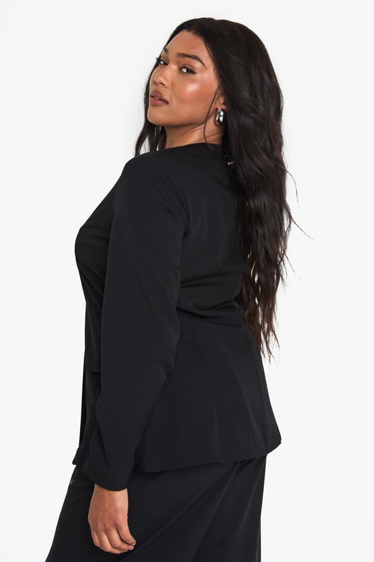 Striking plunge neckline for a bold, contemporary silhouette
        Structured shoulders create a flattering, defined shape
        Practical front pockets add functionality to this stylish piece
        Long sleeves with clean-cut finish for a sophisticated look
        Versatile design perfect for transitioning from day to night
    
    Make a statement with this curve-enhancing blazer featuring a daring plunge neckline that commands attention. The tailored fit creates a sleek silhouette whilst the structured design offers a contemporary twist on classic tailoring. Style with the matching wide-leg trousers as seen on our model for a coordinated evening ensemble, or pair with your favourite jeans and heels for drinks with the girls. For club nights, accessorise with statement earrings and a clutch bag to showcase the blazer's dramatic neckline. This versatile piece works brilliantly for urban nightlife settings where you want to project confidence and style without compromising on comfort. The clean lines and unfussy detailing ensure this blazer remains a wardrobe staple that you'll reach for time and again when planning your going-out looks.
