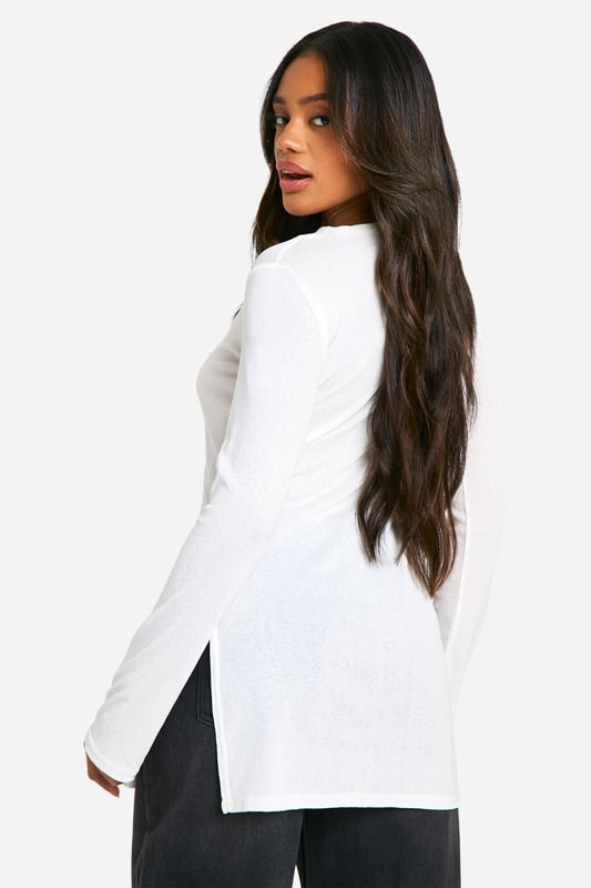 Transparent maxi top for a daring look
        Elegant turtleneck design adds sophistication
        Long sleeves for versatile styling options
        Side slits enhance movement and comfort
        Fitted silhouette accentuates your curves
    
    Make a bold statement with this transparent maxi top, perfect for the fashion-forward woman who loves to push boundaries. The turtleneck design adds a touch of elegance, while the long sleeves offer versatility for various occasions. Style it over a sleek bodysuit or bralette for a night out, or layer it over a cami for a more subdued daytime look. The side slits not only provide ease of movement but also create an alluring silhouette. Pair with wide-leg trousers and strappy heels for a chic ensemble, or dress it down with your favourite jeans and trainers for a casual yet trendy outfit. This top is ideal for those who want to make an impression at social gatherings, brunches with friends, or even as a unique layering piece for festival season. Its versatility allows you to customise your look, making it a must-have addition to any fashion-savvy wardrobe.
