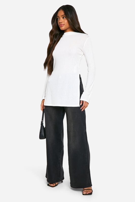 Transparent maxi top for a daring look
        Elegant turtleneck design adds sophistication
        Long sleeves for versatile styling options
        Side slits enhance movement and comfort
        Fitted silhouette accentuates your curves
    
    Make a bold statement with this transparent maxi top, perfect for the fashion-forward woman who loves to push boundaries. The turtleneck design adds a touch of elegance, while the long sleeves offer versatility for various occasions. Style it over a sleek bodysuit or bralette for a night out, or layer it over a cami for a more subdued daytime look. The side slits not only provide ease of movement but also create an alluring silhouette. Pair with wide-leg trousers and strappy heels for a chic ensemble, or dress it down with your favourite jeans and trainers for a casual yet trendy outfit. This top is ideal for those who want to make an impression at social gatherings, brunches with friends, or even as a unique layering piece for festival season. Its versatility allows you to customise your look, making it a must-have addition to any fashion-savvy wardrobe.