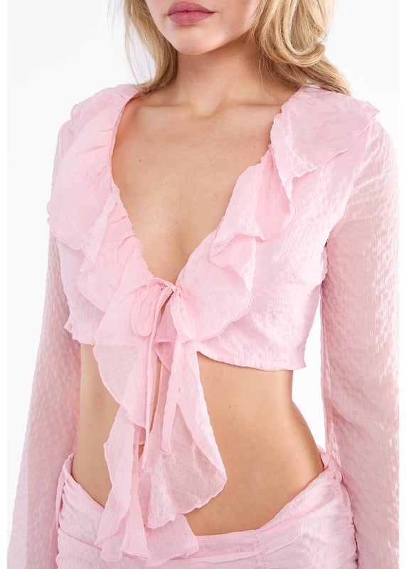 Esta minifalda rosa de gasa texturizada con dobladillo de volantes combina un estilo alegre con un uso cómodo. Su ligero tejido de gasa ofrece un tacto suave y vaporoso, mientras que el diseño texturizado añade interés visual. El bajo con volantes le da un toque atrevido y coqueto, perfecto para salidas informales o para llamar la atención con facilidad.