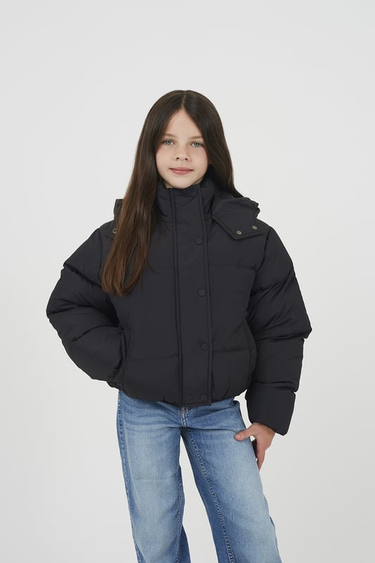 Designed for warmth and everyday functionality, this jacket from Ruby Tuesday by Brave Soul features all-over padding for reliable insulation and a fixed hood for added weather protection. Two lower pockets provide convenient storage, while elasticated cuffs and hem offer a secure and comfortable fit. Ideal for daily wear, whether heading to school or out and about. Model wears 9-10 years.