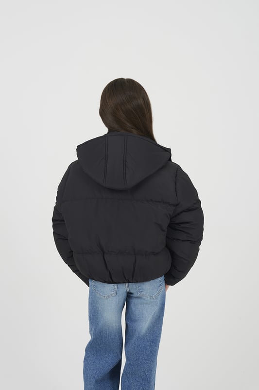 Designed for warmth and everyday functionality, this jacket from Ruby Tuesday by Brave Soul features all-over padding for reliable insulation and a fixed hood for added weather protection. Two lower pockets provide convenient storage, while elasticated cuffs and hem offer a secure and comfortable fit. Ideal for daily wear, whether heading to school or out and about. Model wears 9-10 years.