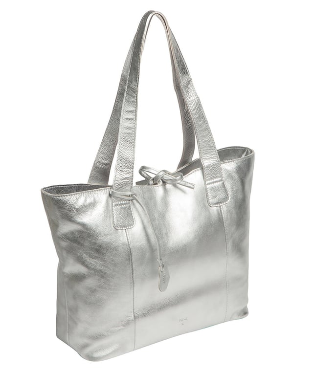 Handcrafted from natural leather with a soft to the touch pebble grain finish, the 'Carolina' tote bag from NiNa Amora is a must-have accessory. A unique tie top secures the central lined compartment which includes a zipped compartment which divides the design; perfect for maintaining an organised bag. Additional storage space is provided by a slip and zipped pocket on the interior, ideal for your phone, keys and any other essentials while out and about. Adorned with dual leather handles with a drop length of 25cm for a comfortable and versatile carrying options. Silver metal fittings and zips give this design a elegant look which is complemented the NiNa Amora X logo is silver foil embossed on the front and hanging charm for a luxurious finishing touch.