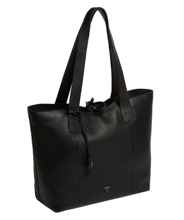 Handcrafted from natural leather with a soft to the touch pebble grain finish, the 'Carolina' tote bag from NiNa Amora is a must-have accessory. A unique tie top secures the central lined compartment which includes a zipped compartment which divides the design; perfect for maintaining an organised bag. Additional storage space is provided by a slip and zipped pocket on the interior, ideal for your phone, keys and any other essentials while out and about. Adorned with dual leather handles with a drop length of 25cm for a comfortable and versatile carrying options. Silver metal fittings and zips give this design a elegant look which is complemented the NiNa Amora X logo is silver foil embossed on the front and hanging charm for a luxurious finishing touch.