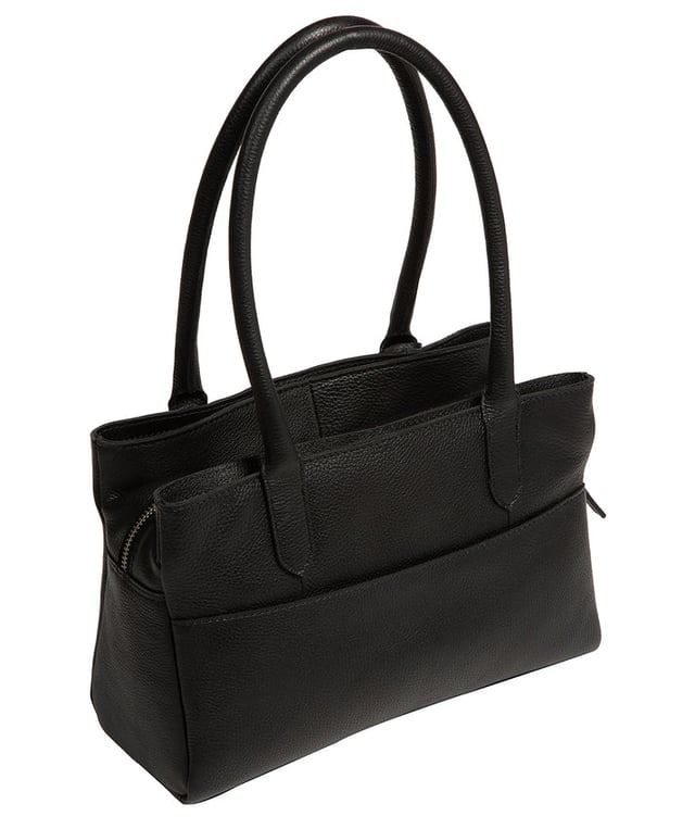 The 'Beatriz' handbag from NiNa Amora is crafted from natural leather with a soft to the touch pebble grain finish. This classic design is elevated thanks to the unique trio of main compartments. This comes in the form of a zipped central section with two magnetic press stud fastened slip pockets on either side; perfect for maintaining an organised accessory. Additional storage space is provided by slip pockets on the interior and exterior alongside a zipped pocket which lines the interior. Dual rounded leather handles adorn the bag with a drop length of 20cm. Silver coloured metal fittings and zips give this design a elegant look which pops against the leather exterior and complemented the NiNa Amora X logo which is silver foil embossed on the front and hanging charm for a luxurious finishing touch.