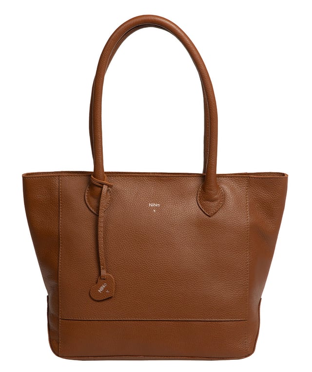 As part of the NiNa Amora brand, the 'Margarida' tote bag is inspired by our designer's daughter and all about elevating classic designs with high quality leather. A concealed zip-over top secures the spacious main lined compartment which opens to reveal additional storage space in the form of a slip and zipped pocket; ideal for your phone, keys and any other essentials. The classic angular sides of the tote are updated with this sophisticated design and adorned with slim leather handles with a drop length of 20cm. This bag is finished with sophisticated silver metal fittings and zips which are complemented by the NiNa Amora X logo embossed in silver on the front and on the hanging charm. Effortlessly chic.