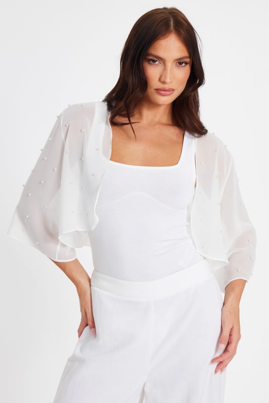 - Sheer finish - Cropped sleeves - Flowy design - Pearl embellishment - Always check the wash care label - Cool hand wash with mild detergent